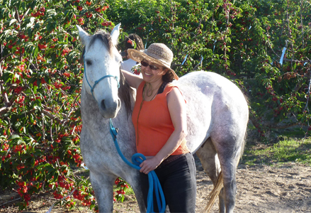 Homeira with a grey horse
