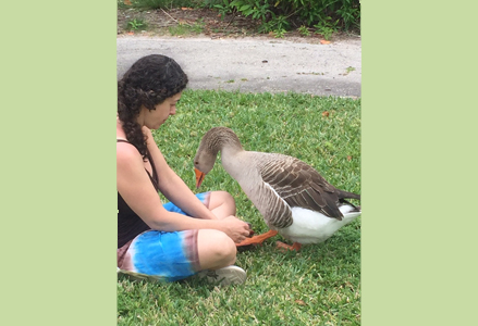 Homeira with a goose in her lap