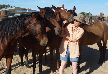 Homeira with a herd of horses